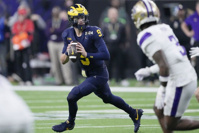 Michigan Wolverines quarterback J.J. McCarthy looks downfield to pass in the fourth quarter against the Washington Huskies during the 2024 College Football Playoff final Monday at NRG Stadium in Houston. Photo by Kevin M. Cox/UPI