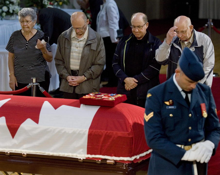 Mourners pay their respects to the late governor general Romeo LeBlanc as he lays in state in the chapel at the Memramcook Institute in Memramcook, N.B. on Thursday July 2, 2009. LeBlanc died last week after a lengthy illness at age 81. THE CANADIAN PRESS/Andrew Vaughan