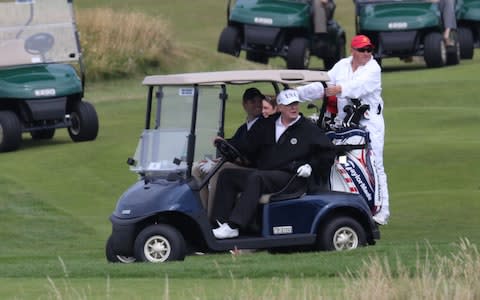 US President Donald Trump plays a round of golf on the Trump Turnberry resort in South Ayrshire, where he and first lady Melania Trump are spending the weekend - Credit: PA