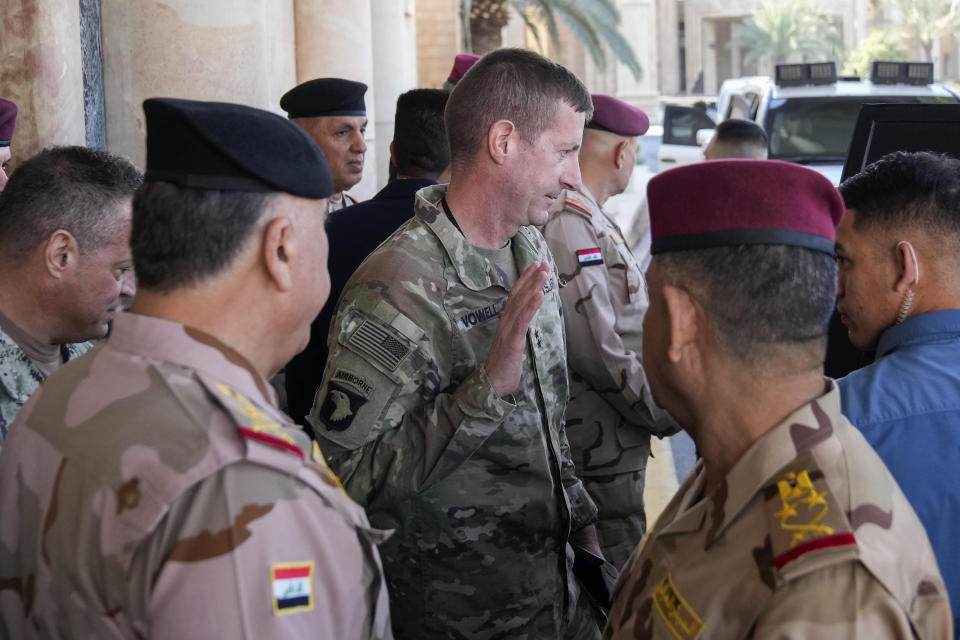 Major General Joel "J.B." Vowell, center, leaves after the first round of the negotiations between Iraq and the United States to end the International Coalition mission in Baghdad, Iraq, Saturday, Jan. 27, 2024. (AP Photo/Hadi Mizban, Pool)