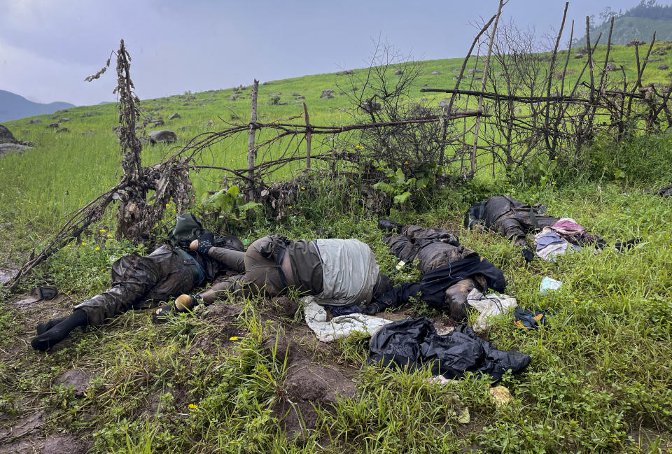 The dead bodies of unidentified people wearing military uniforms lie on the ground near the village of Chenna Teklehaymanot, in the Amhara region of northern Ethiopia Thursday, Sept. 9, 2021. At the scene of one of the deadliest battles of Ethiopia's 10-month Tigray conflict, witness accounts reflected the blurring line between combatant and civilian after the federal government urged all capable citizens to stop Tigray forces "once and for all." (AP Photo)