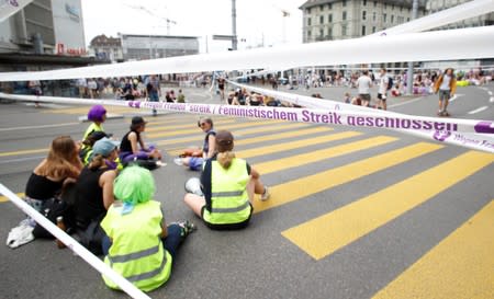 The traffic is blocked by participants of the women's strike at the Central Square in Zurich