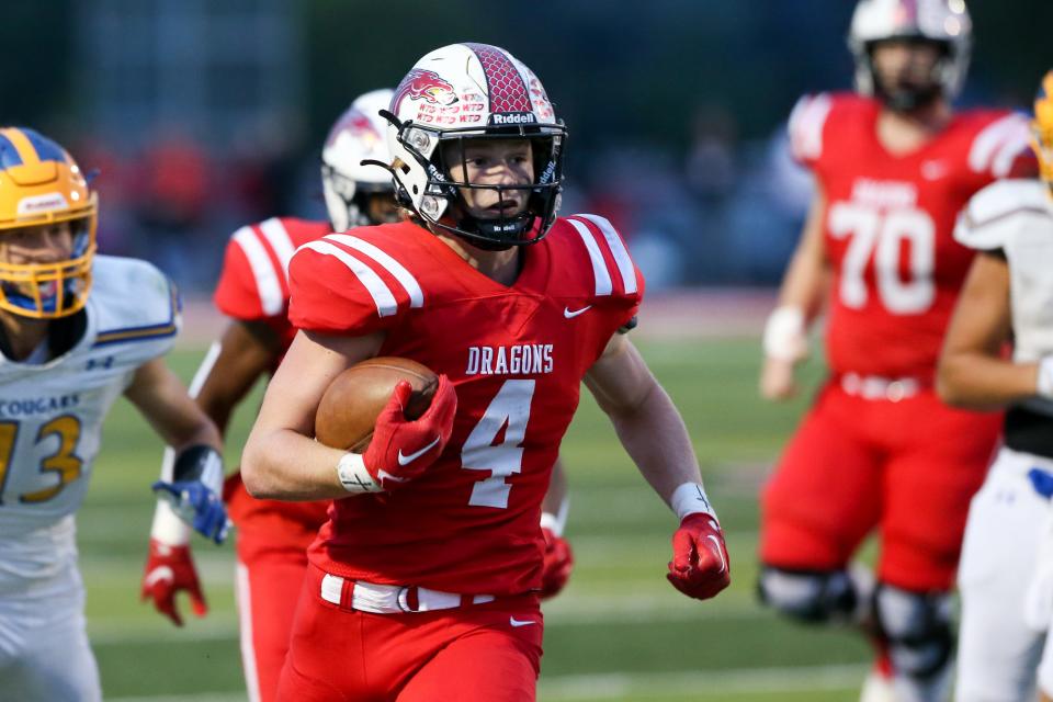 New Palestine Grayson Thomas (4) finds an opening to the goal line for a score at the New Palestine vs Greenfield-Central high school varsity football game, Sep 23, 2022; New Palestine, IN;  at New Palestine High School. Gary Brockman-For Indy Star