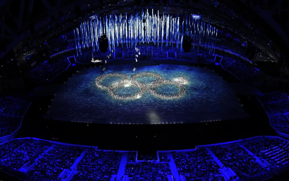 Performers recreate the ring that did not open during the opening ceremony during the closing ceremony of the 2014 Winter Olympics, Sunday, Feb. 23, 2014, in Sochi, Russia. (AP Photo/David J. Phillip )