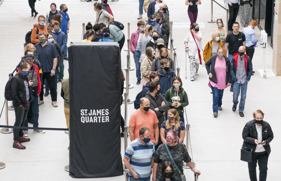 People queue for shops at the opening of the St James Quarter shopping centre in Edinburgh (PA) (PA Archive)