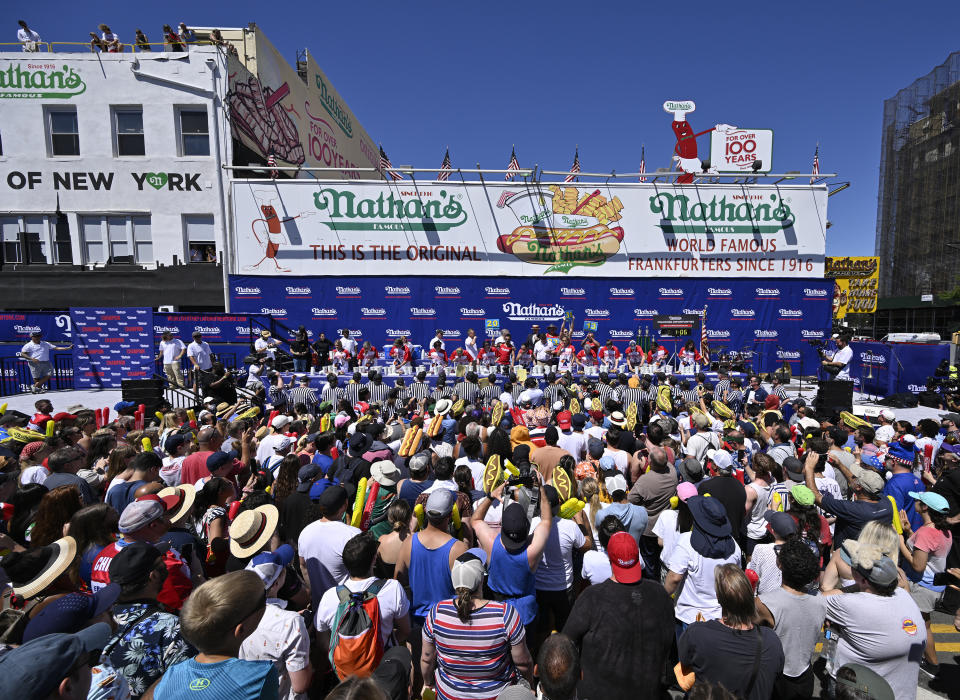 A crowd watches as contestants go head-to-head at the competition in Coney Island (Major League Eating/PA)