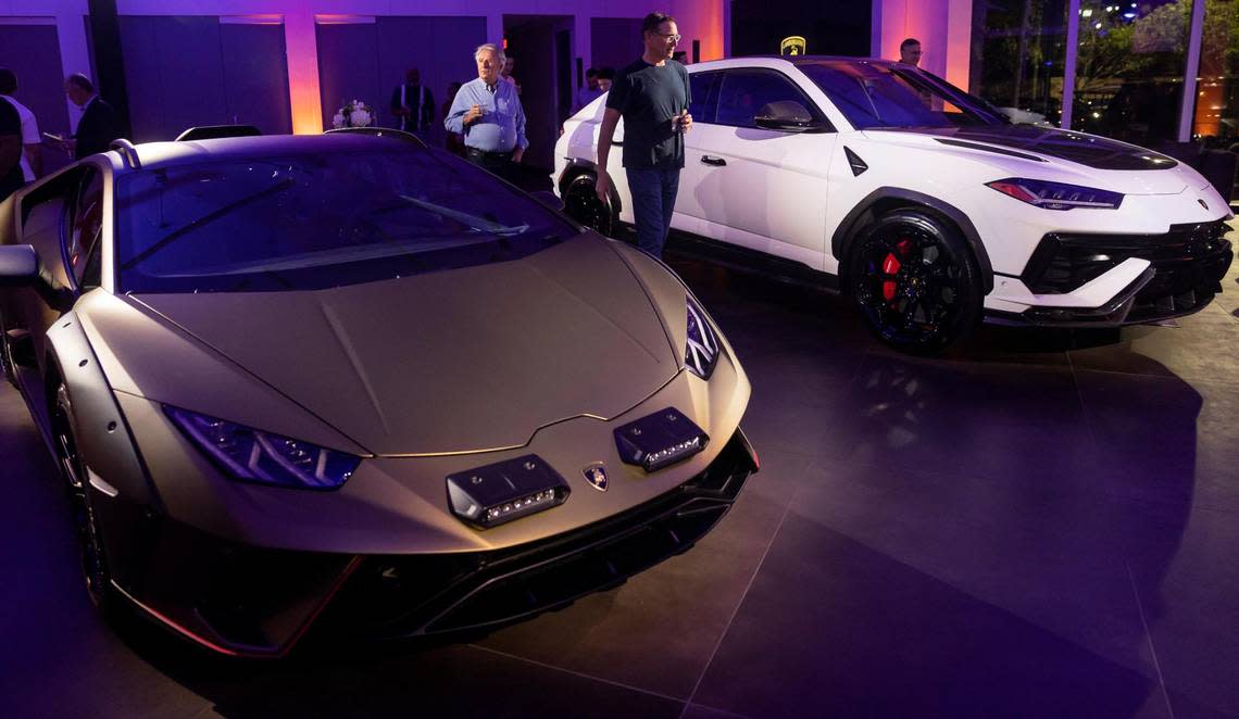 A Lamborghini Huracán Sterrato, left, and a Lamborghini Urus are on display in the new showroom at the Lamborghini Broward dealership on Jan. 30, 2023, in Davie.