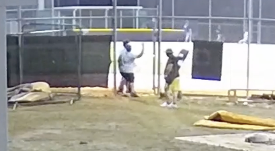 A screengrab from surveillance video shows an umpire being attacked at a high school baseball game.