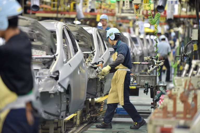An assembly line for the Toyota Prius at the company's plant in Toyota on December 4, 2014