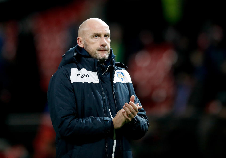 Colchester United manager John McGreal acknowledges the fans after the final whistle during the Carabao Cup quarter final match at Old Trafford, Manchester. (Photo by Martin Rickett/PA Images via Getty Images)