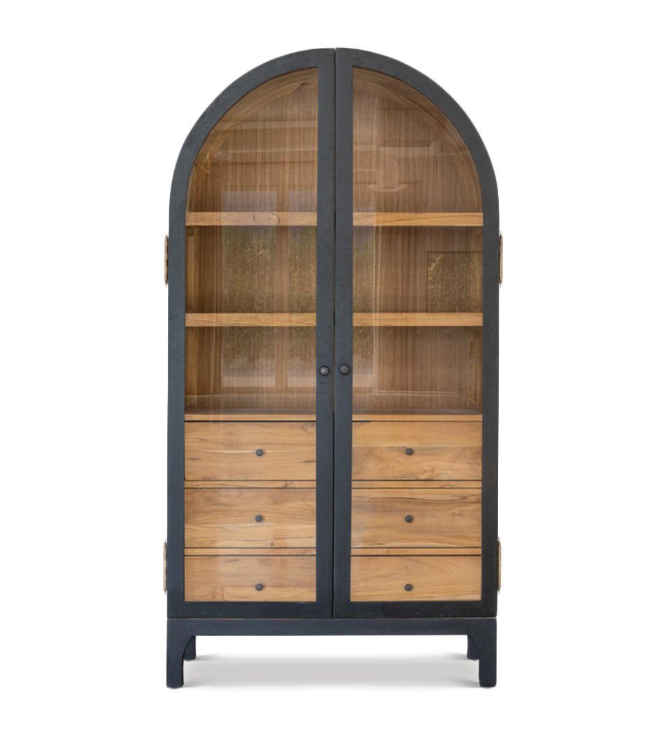 This image released by designer Lindye Galloway shows the Bixby hutch, featuring the rounded silhouette of Big Sur’s Bixby Canyon Bridge arch, in natural teak trimmed in black. (Lindye Galloway via AP)