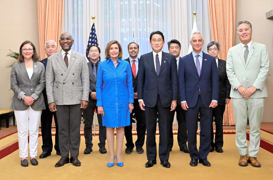 Japan’s prime minister Fumio Kishida and US house speaker Nancy Pelosi pose for a photo session at the prime minister’s official residence in Tokyo on 5 August 2022 (JAPAN POOL / JIJI PRESS/AFP via)