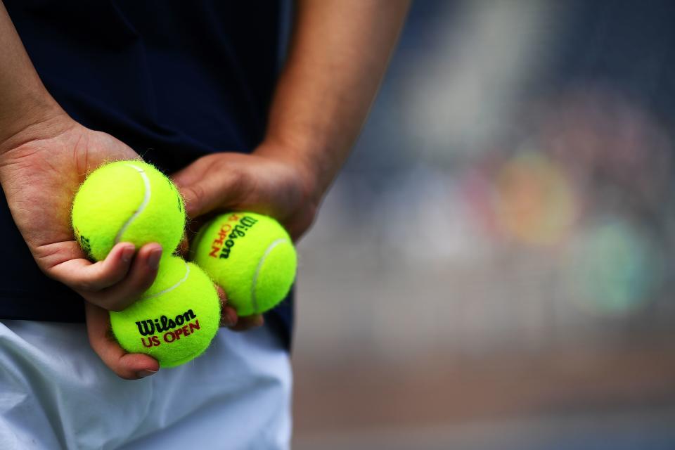 A ball boy waits on a court during a match of the 2017 US Open at the USTA Billie Jean King National Tennis Center in New York on August 28, 2017.