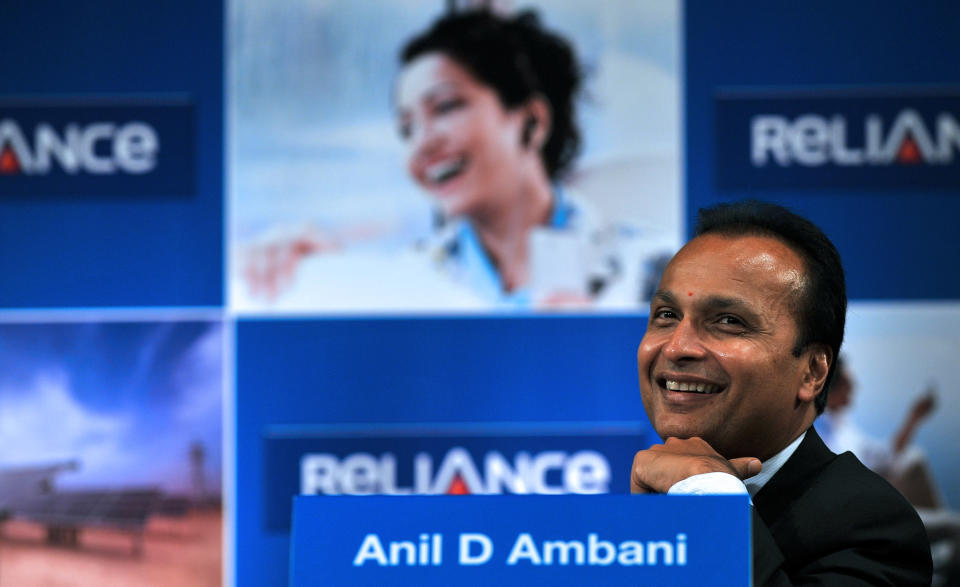 Indian industrialist and Chairman of ADAG (Anil Dhirubhai Ambani Group) Anil Ambani smiles during the annual general meeting of Reliance Power in Mumbai on September 4, 2012. Reliance Power, controlled by billionaire Anil Ambani, said that it started production at two coal mines in central India, ahead of schedule, which sent its shares up two percent. Coal from the Sasan mines will be used to generate electricity at the firm's 3,960-megawatt power project in the same region, a company statement said. AFP PHOTO/ INDRANIL MUKHERJEE