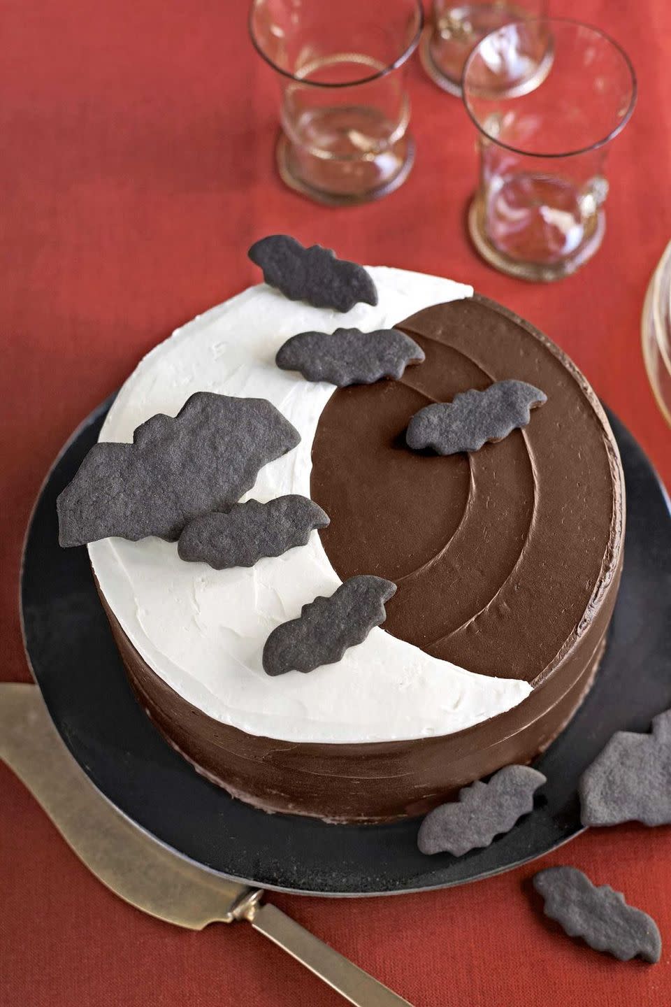 <p>Elevate your basic chocolate cake with these simple decorations that will turn your year-round dessert into a Halloween masterpiece.</p><p><em><a href="https://www.womansday.com/food-recipes/food-drinks/recipes/a26386/over-the-moon-cake-recipe/" rel="nofollow noopener" target="_blank" data-ylk="slk:Get the recipe for Over the Moon Cake;elm:context_link;itc:0;sec:content-canvas" class="link ">Get the recipe for Over the Moon Cake</a>.</em></p>