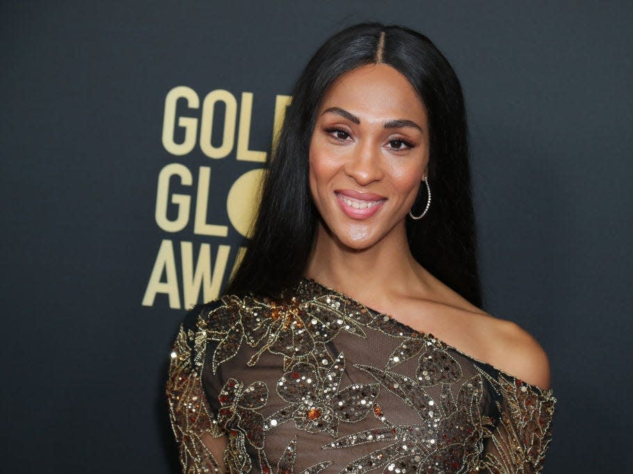 Mj Rodriguez at the Golden Globes wearing an off-the-shoulder dress