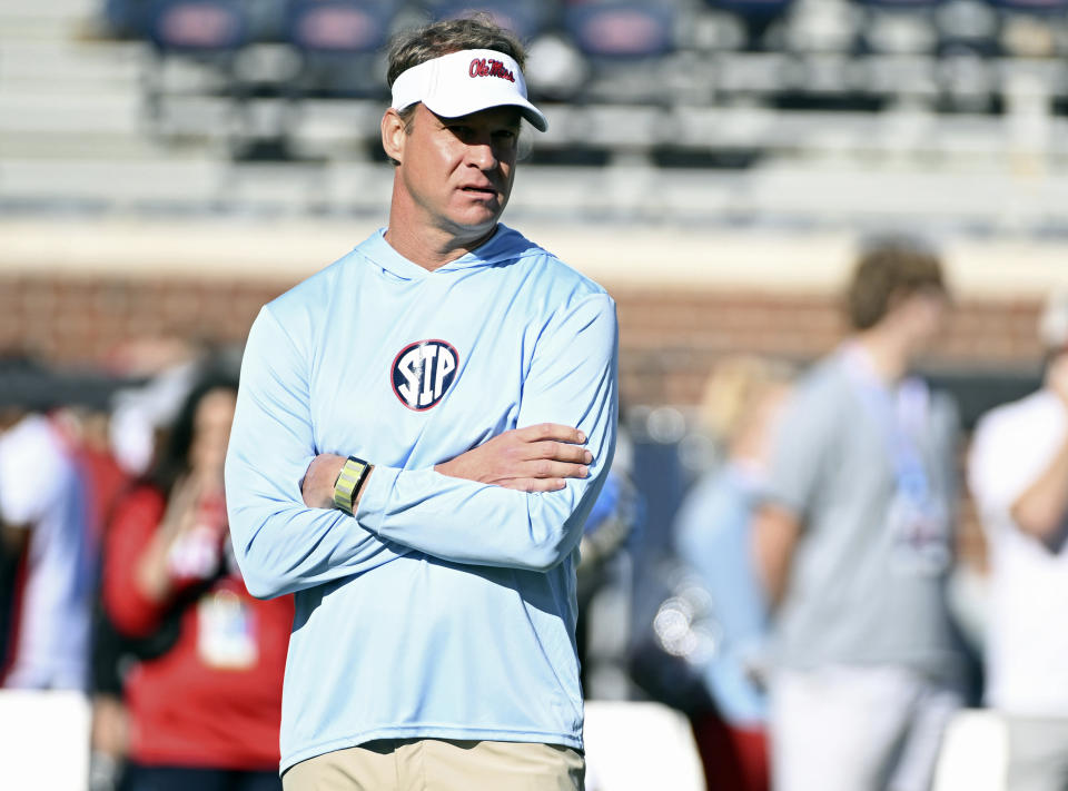 FILE - Mississippi head coach Lane Kiffin watches warmups before an NCAA college football game against Texas A&M in Oxford, Miss., Nov. 4, 2023. Mississippi will play for the first 11-win season in school history when the Rebels of the Southeastern Conference, led by quarterback Jaxson Dart, face Penn State, led by quarterback Drew Allar, in the Peach Bowl, Saturday, Dec. 30, 2023. (AP Photo/Thomas Graning, File)