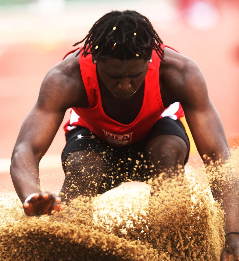 NFA's Jeremiah Paul competes in the long jump during the CIAC Class LL Track and Field State Championship in New Britain.
(Photo: [John Shishmanian/ NorwichBulletin.com])