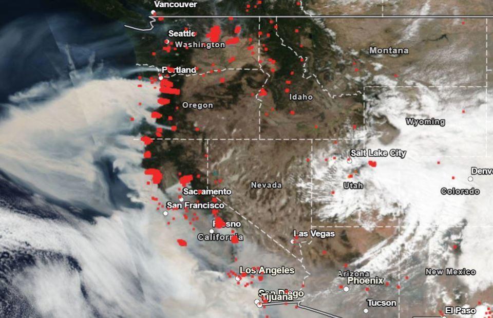 NASA image shows locations of wildfires in red and plumes of smoke across the Western U.S.  / Credit: NASA