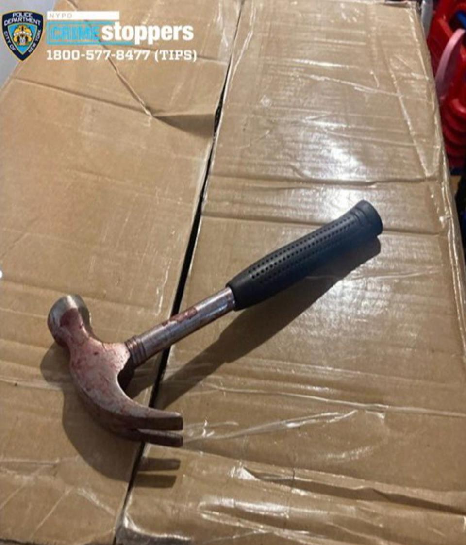 A bloodied hammer was recovered by cops in the building following the attack (NYPD)