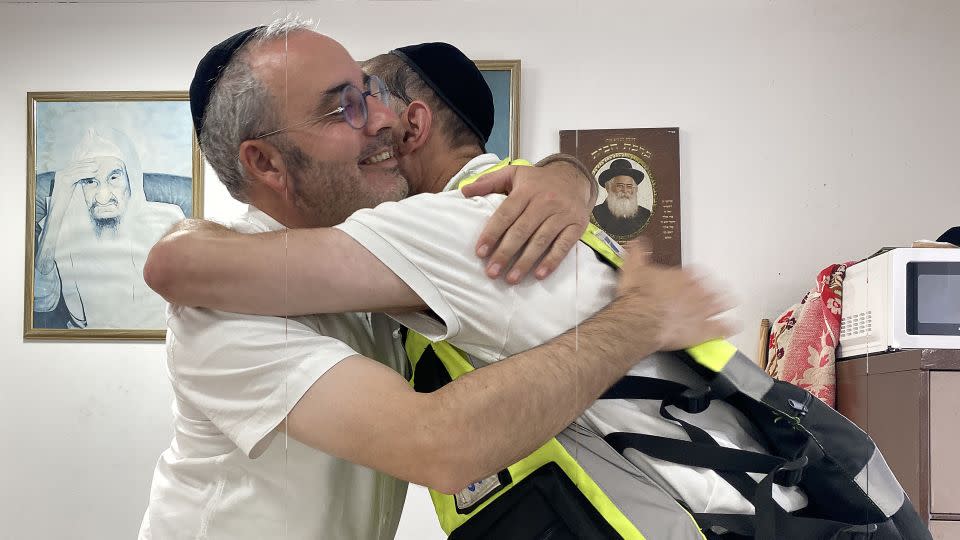 Yossi Landau greets Snir Elmalih at his office in Ashkelon, Israel, on Friday, October 20, 2023. - Ivana Kottasová/CNN