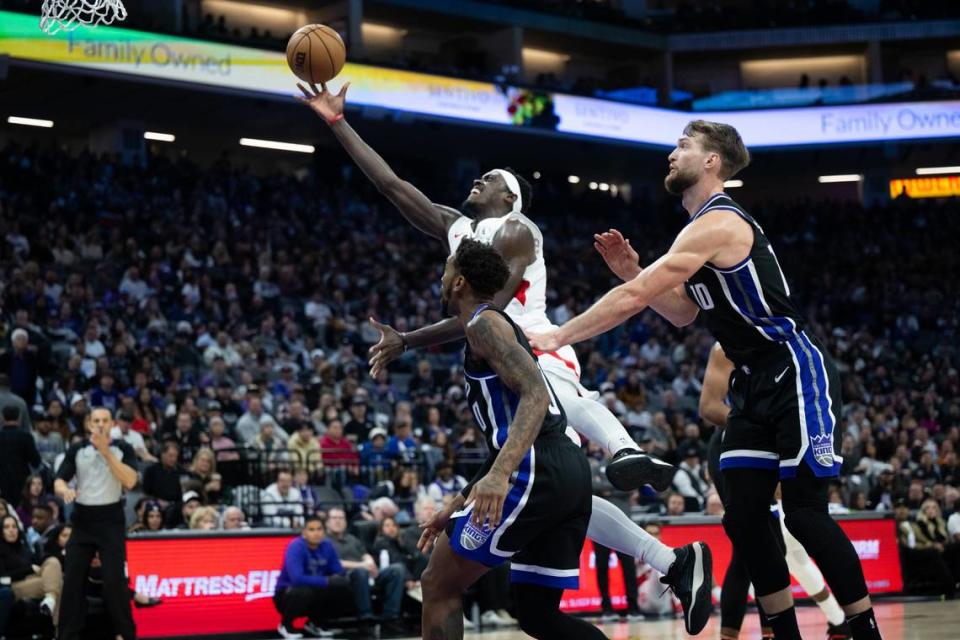 Toronto Raptors forward Pascal Siakam (43) drives for a basket over Sacramento Kings guard Malik Monk (0) during an NBA game at Golden 1 Center on Friday, Jan. 5, 2024.