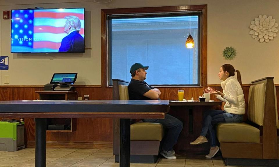 An advertisement for Donald Trump’s re-election campaign plays as people sit in a diner in the Northampton county city of Easton.