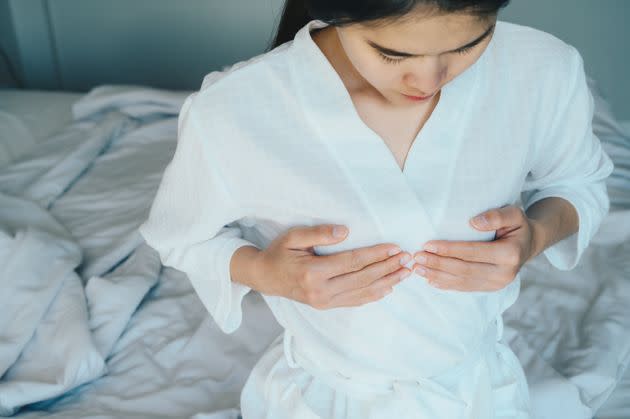 Random changes in your boob size, nipple discharge and skin inflammation are all signs of breast cancer. (Photo: Boy_Anupong via Getty Images)