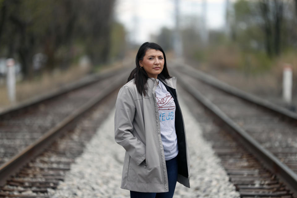 Brenda Santoyo, a policy associate at the Little Village Environmental Justice Organization poses for a portrait on Sunday, April 11, 2021 in Chicago's predominantly Latino Little Village neighborhood. President Joe Biden’s proposal to get rid of every lead water pipe in the country could have huge ramifications. That's especially true in communities where a large number of Black, Latino and low-income residents have been left effectively drinking from a lead straw. The problem persists decades after scientists established that lead consumption is unsafe at any level. Biden announced the pipe proposal as part of his $2.3 trillion infrastructure package. (AP Photo/Shafkat Anowar)