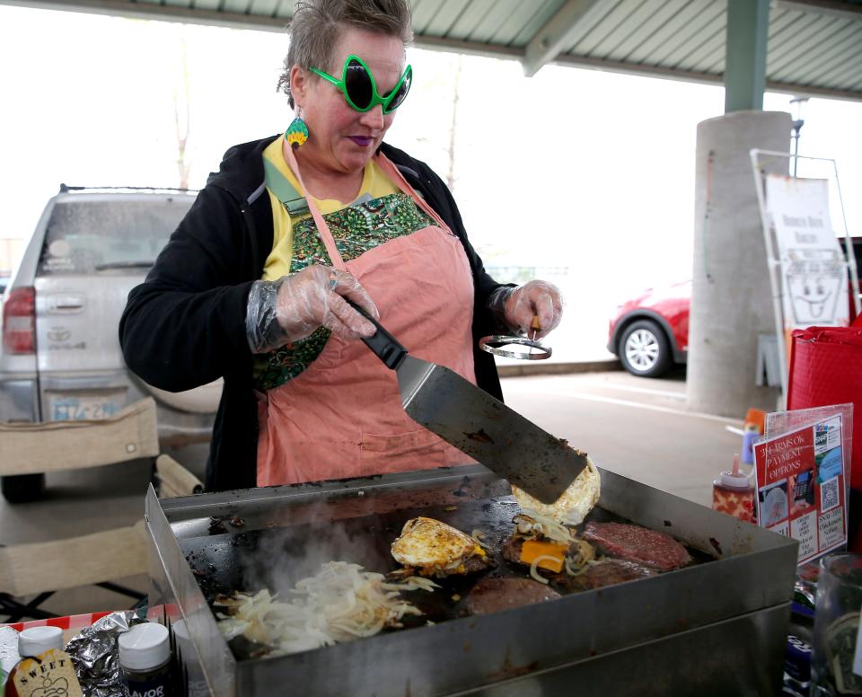 Jennifer Hernandez, with 3J Farms, makes breakfast sandwiches on April 15, 2023, during the Edmond Farmers Market.