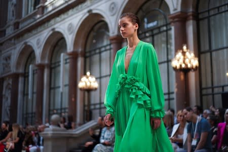 A model presents a creation during the Victoria Beckham catwalk show at London Fashion Week in London