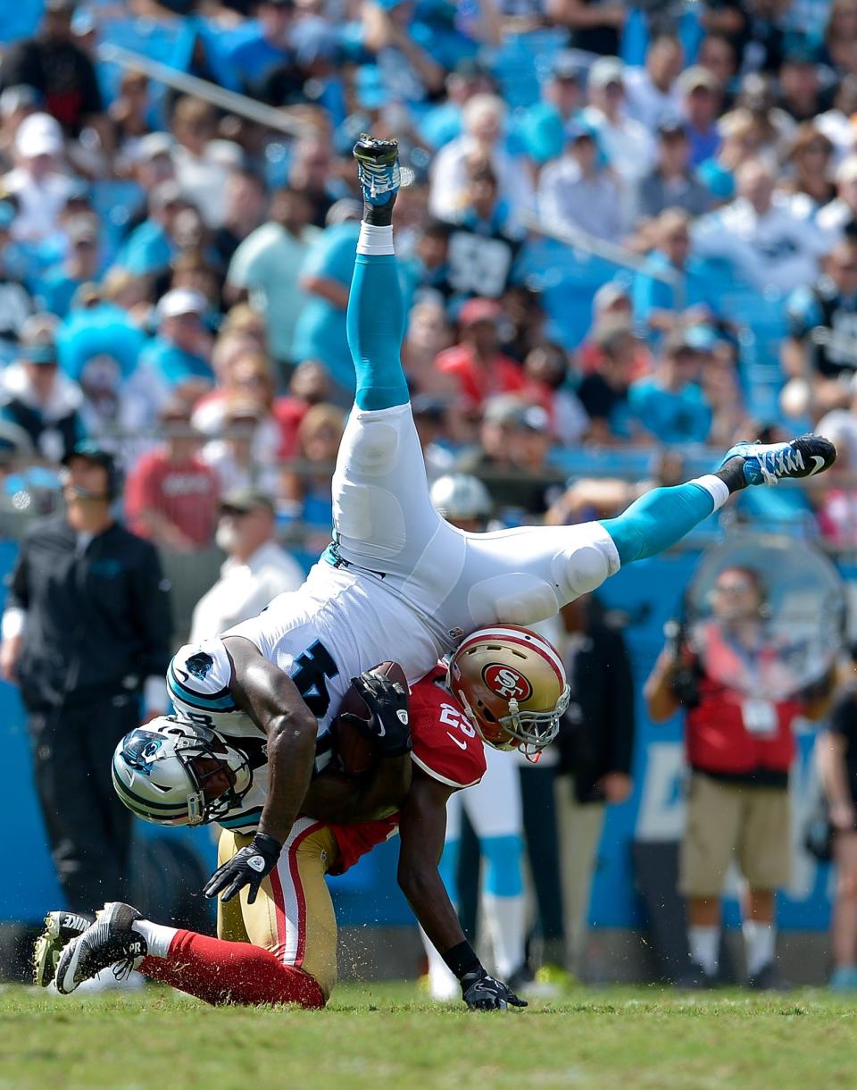 <p>Jimmie Ward #25 of the San Francisco 49ers tackles Ed Dickson #84 of the Carolina Panthers in the 3rd quarter during the game at Bank of America Stadium on September 18, 2016 in Charlotte, North Carolina. (Photo by Grant Halverson/Getty Images) </p>