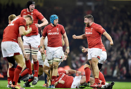 Rugby Union - Six Nations Championship - Wales v England - Principality Stadium, Cardiff, Britain - February 23, 2019 Wales' Adam Beard, Justin Tipuric and Nicky Smith celebrate victory after the match REUTERS/Rebecca Naden