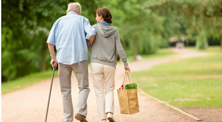 The teacher walks next to the man in the park.  Known as a “welfare bridge,” a retirement strategy is one way to create an expanded, non-annuity guaranteed income stream. 