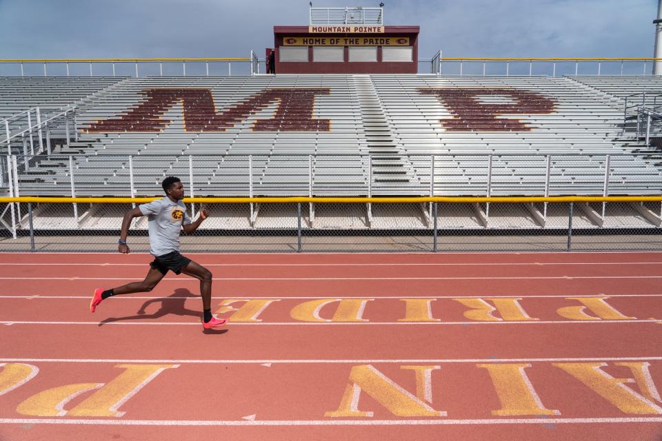 Jayden Davis, 18, a senior on Mountain Pointe High School's track team, poses for a portrait on campus in Phoenix on April 13, 2023.