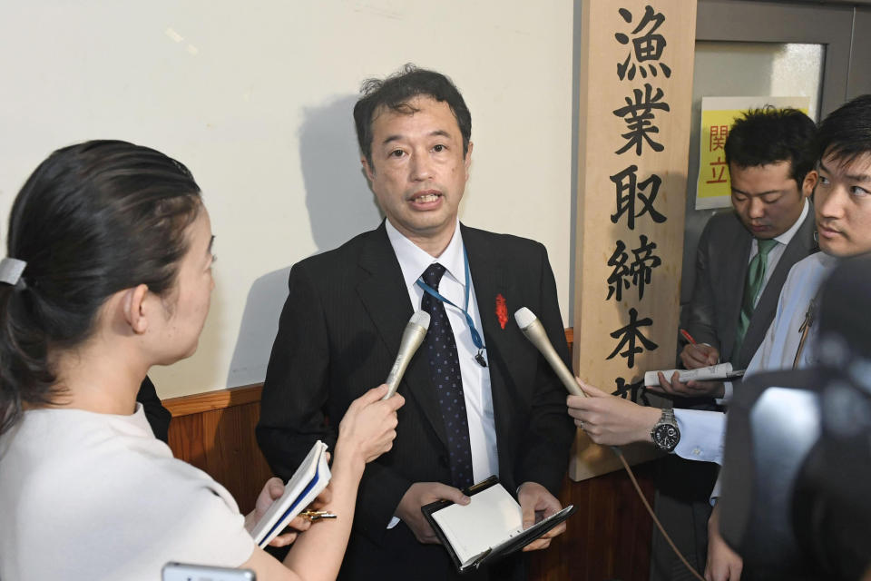 An official of the Japanese Fisheries Agency speaks to media following a collision between its patrol boat and a North Korean fishing boat, in Tokyo Monday, Oct. 7, 2019. The agency said Monday's collision occurred in the area known as Yamatotai, off Japan's northern coast of the Noto Peninsula. (Mizuki Ikari/Kyodo News via AP)