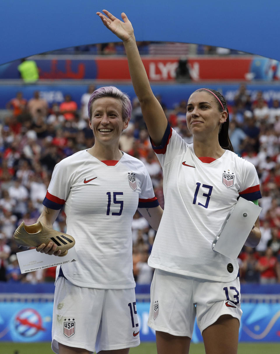 United States' Megan Rapinoe, left, and her teammate Alex Morgan, right, after winning the Women's World Cup final soccer match between US and The Netherlands at the Stade de Lyon in Decines, outside Lyon, France, Sunday, July 7, 2019. (AP Photo/Alessandra Tarantino)