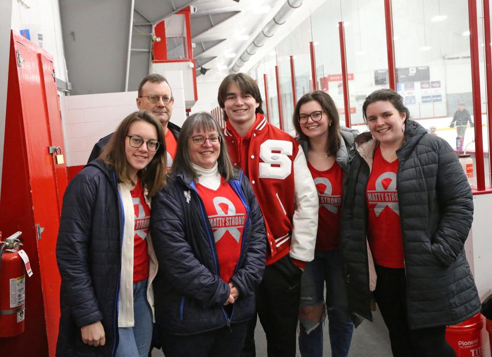 Spaulding High School athlete Matt Gould, center, poses with his family before Wednesday's Division II boys hockey game against Portsmouth/Newmarket at Rochester Ice Arena.