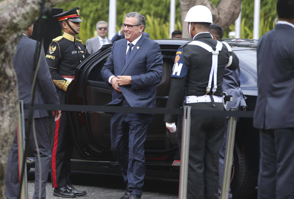 Moroccan Prime Minister Aziz Akhannouch, center, walks upon his arrival of the 10th World Water Forum in Nusa Dua, Bali, Indonesia on Monday, May 20, 2024. (AP Photo/Firdia Lisnawati)