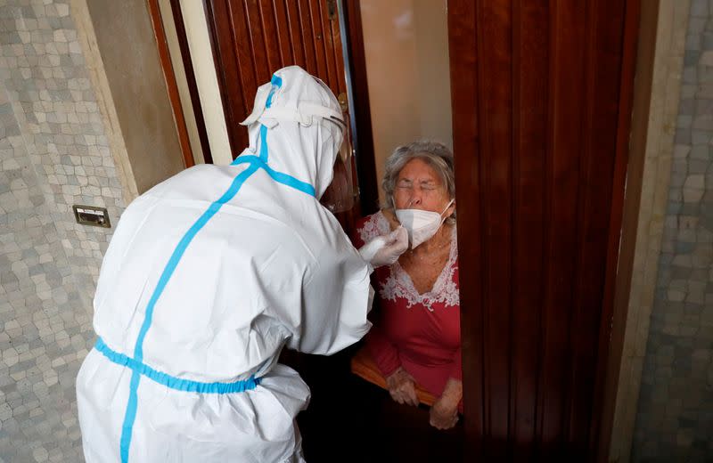 FILE PHOTO: Medics visit homes of suspected coronavirus disease (COVID-19) patients in Rome