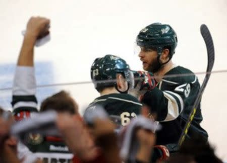 Apr 24, 2016; Saint Paul, MN, USA; Minnesota Wild forward Jason Pominville (29) celebrates his goal with the bench during the third period against the Dallas Stars in game six of the first round of the 2016 Stanley Cup Playoffs at Xcel Energy Center. Marilyn Indahl-USA TODAY Sports