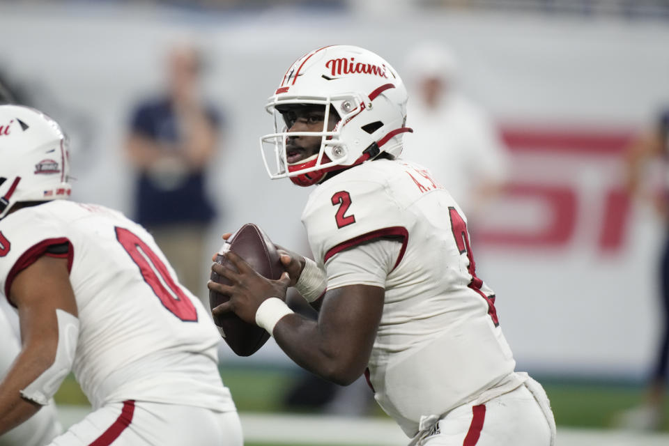 Miami (Ohio) quarterback Aveon Smith (2) looks to pass during the first half of the Mid-American Conference championship NCAA college football game against Toledo, Saturday, Dec. 2, 2023, in Detroit. (AP Photo/Carlos Osorio)