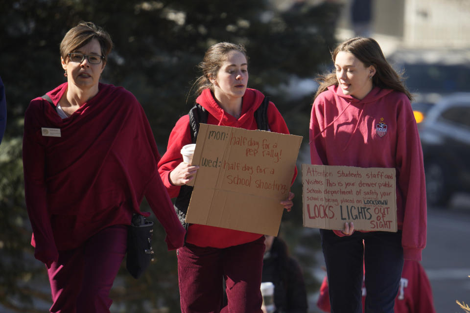 Students from East High School and West High School call for gun control measures to be considered by state lawmakers Thursday, March 23, 2023, during a rally outside the State Capitol in Denver. A shooting left two administrators injured at East High School on Wednesday, one of a series of gun-related events at the school in the past six weeks. (AP Photo/David Zalubowski)