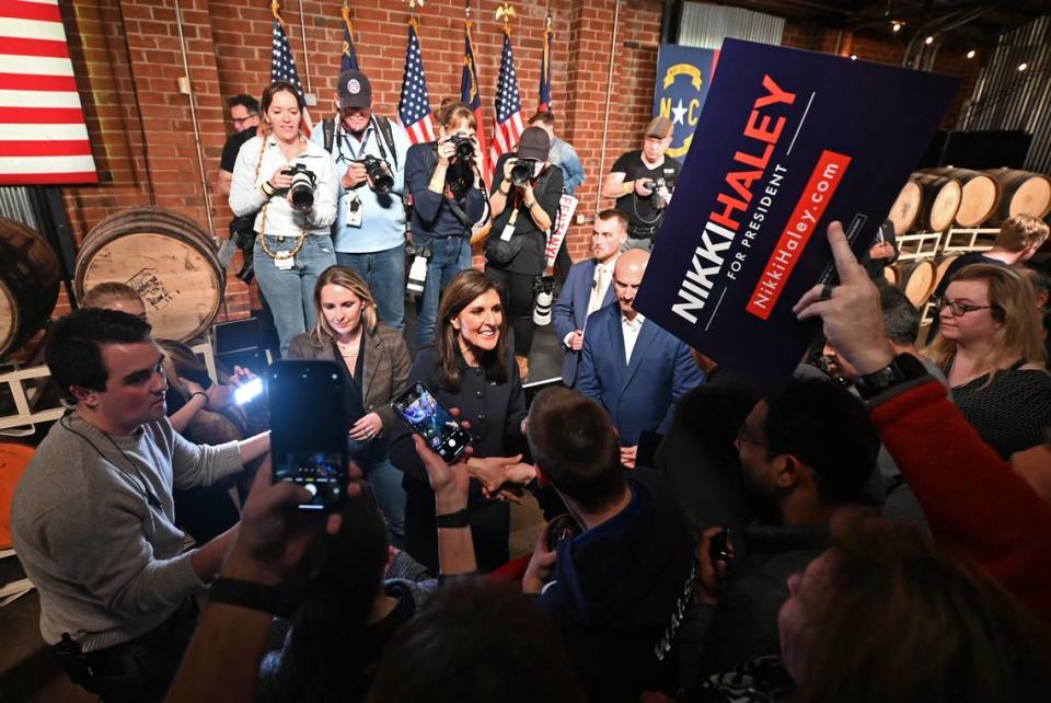 Nikki Haley, center, smiles at supporters as she shakes hands and signs autographs at Norfolk Hall at Suffolk Punch in SouthEnd following her speech on Friday, March 1, 2024 in Charlotte, NC. JEFF SINER/jsiner@charlotteobserver.com