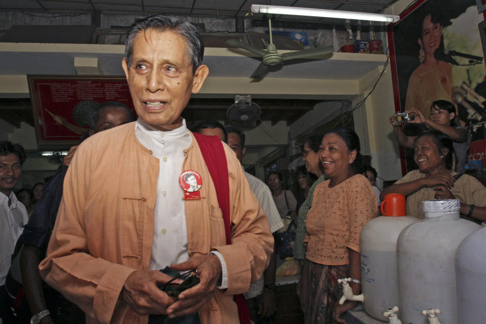 FILE - Tin Oo, deputy leader of the detained pro-democracy leader Aung San Suu Kyi's National League for Democracy, shares a light moment with members of the party at their headquarters before its closing Thursday, May 6, 2010, in Yangon, Myanmar. Tin Oo, one of the closest associates of Myanmar’s ousted leader Aung San Suu Kyi as well as a co-founder of her National League for Democracy party, has died. He was 97.(AP Photo/Khin Maung Win, File)