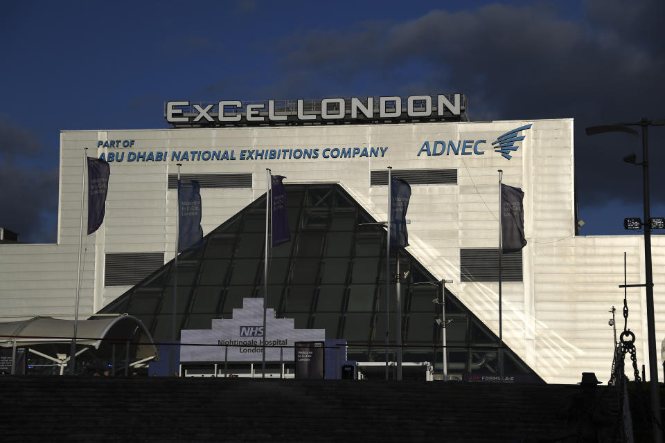 General view of the Excel exhibition centre which has been converted into a hospital due to the Coronavirus emergency, in London, Saturday, March 28, 2020. The British Government announced Tuesday, that the ExCel Center in east London will become a 4,000 bed temporary hospital to deal with future coronavirus patients, to be called NHS Nightingale. The new coronavirus causes mild or moderate symptoms for most people, but for some, especially older adults and people with existing health problems, it can cause more severe illness or death.(AP Photo/Alberto Pezzali)