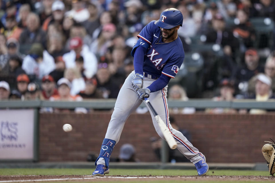 Texas Rangers' Leody Taveras hits an RBI single against the San Francisco Giants during the fourth inning of a baseball game Saturday, Aug. 12, 2023, in San Francisco. (AP Photo/Godofredo A. Vásquez)