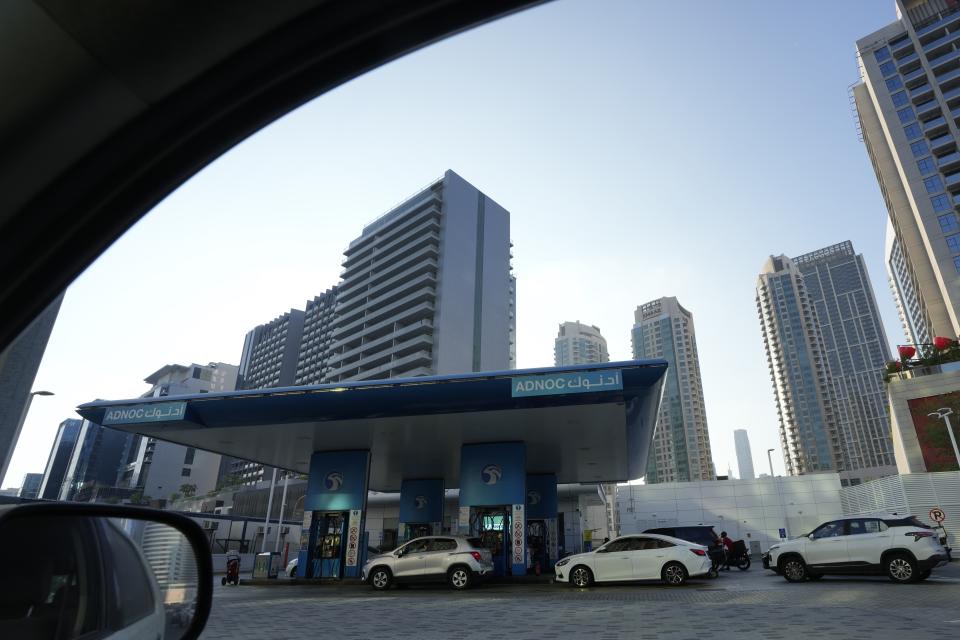 Cars at an ADNOC gas station in Dubai, United Arab Emirates, Saturday, Nov. 4, 2023. (AP Photo/Kamran Jebreili)