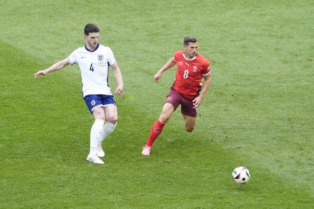 Declan Rice passes the ball during England's match against Switzerland 