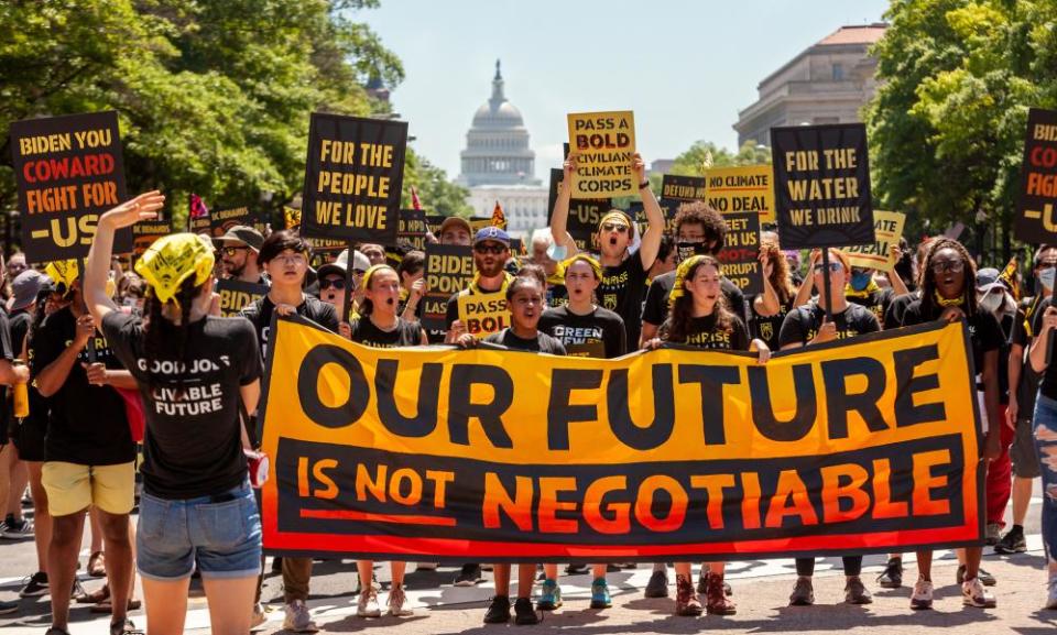 Protest demanding climate action and jobs, Pennsylvania Avenue NW, Washington, USA - 28 Jun 2021Mandatory Credit: Photo by Allison Bailey/REX/Shutterstock (12173478e) Hundreds of protesters march down Pennsylvania Avenue, en route to the White House. Protesters are young adults who are members of the Sunrise Movement. They have 3 demands of the Biden Administration: no compromises on climate with Congressional Republicans, a meeting with Sunrise Movement, and the creation of a Civilian Conservation Corps. Protest demanding climate action and jobs, Pennsylvania Avenue NW, Washington, USA - 28 Jun 2021